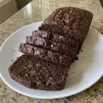 Slices of Chocolate Zucchini Bread arranged on a white plate