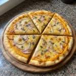 Whole 5 Ingredient Pumpkin and Gouda Pizza cut into six slices