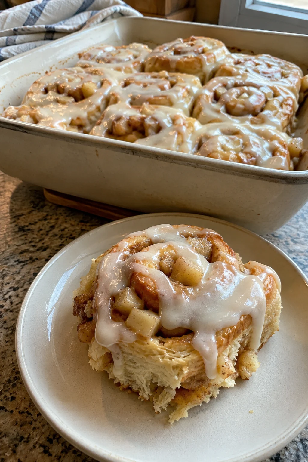 Apple Cinnamon Rolls served warm with creamy glaze for breakfast