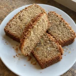 Thick slices of Coconut Banana Bread showing a moist banana and coconut crumb