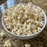 Bowl of Low Calorie Sea Salt Popcorn made with three simple ingredients