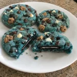 Cookie Monster Cookies with a soft blue center, chocolate chips, and whole sandwich cookie filling