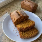 Sliced Mini Pumpkin Bread with Cinnamon showing its soft orange pumpkin crumb
