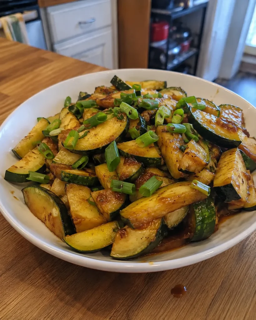 Zucchini Stir-Fry with glossy sauce and sliced scallion greens