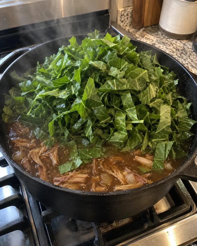 Adding chopped collard greens to smoky pot likker when making Southern Collard Greens