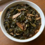Bowl of tender Southern Collard Greens with shredded smoked turkey